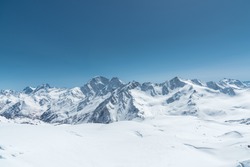 Winter Snow Covered Mountain Peaks In Caucasus. Great Place For Winter Sports