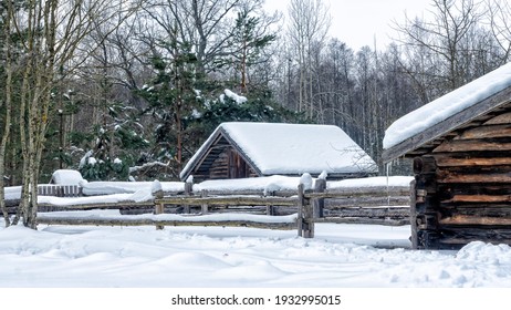 Winter snow covered village house, fence and trees. Nice old village house in the middle of beautiful winter with lots of white snow and trees. - Powered by Shutterstock