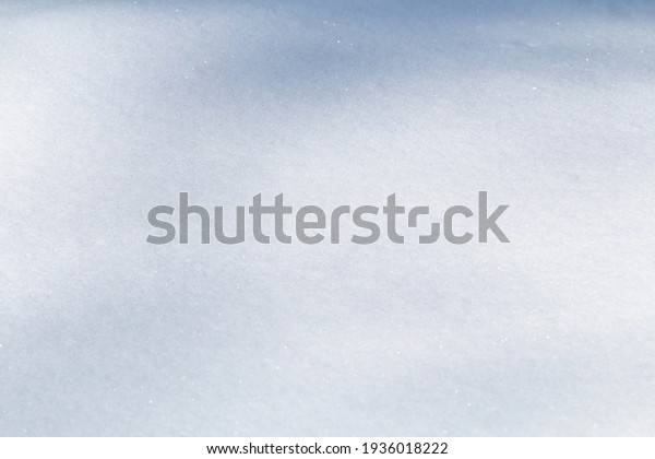 Winter snow. Snow texture Top\
view of the snow. Texture for design. Snowy white texture.\
Snowflakes.