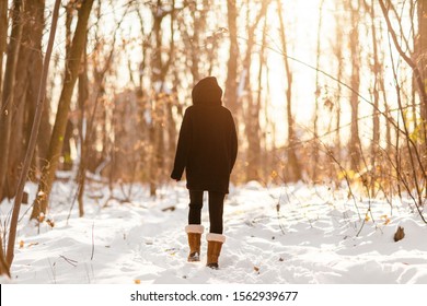 Winter Snow Walk Woman Walking Away In Snowy Forest On Woods Trail Outdoor Lifestyle Active People. Outside Leisure.