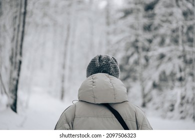 Winter snow walk woman walking away in snowy forest on woods trail outdoor lifestyle active people. Outside leisure. - Shutterstock ID 2097506323