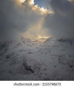 Winter In Snowdonia With Dawn Clouds Over The Glyderau