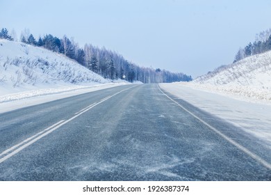 Winter snowy empty highway in a blizzard - Powered by Shutterstock