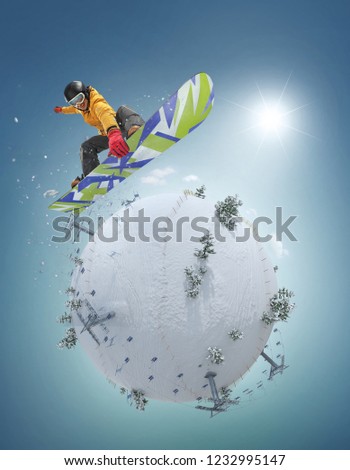 Winter Sport concept. Winter background. Young man jumping on board on white winter planet. 