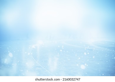 WINTER SPORT ICE HOCKEY FIELD WITH GLOWING ICY SURFACE AND BLUE WHITE HAZE AND GLANCE