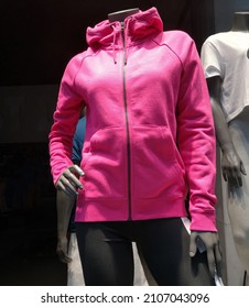 Winter Sport Jacket With Natural Soft Texture On Sale In Retail Store. Display Window Of Casual Sports Clothing Shop With Mannequin Of Woman In Concept Of Fashion, Beauty Industry And Small Business.