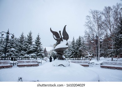 Winter square with a monument