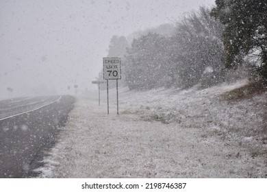 Winter Storm Street With Speed Limit Sign