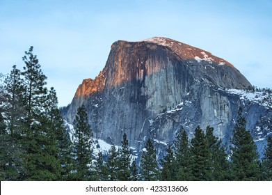 Winter sun setting on Half Dome, Yosemite National Park, California
