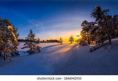 Winter Sunrise In Nature Snow Landscape. Sunrise In Winter Snow Forrest