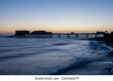 Winter Sunrise Over The Beach, Pier And Promenade At Cromer In North Norfolk, UK