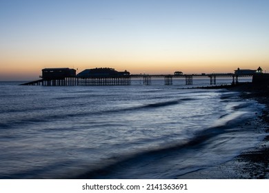 Winter Sunrise Over The Beach, Pier And Promenade At Cromer In North Norfolk, UK