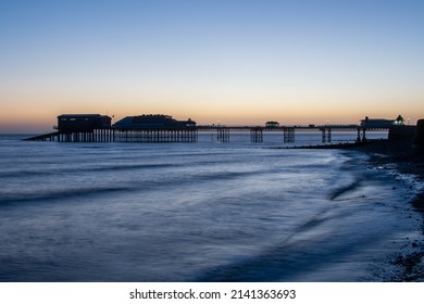 Winter Sunrise Over The Beach, Pier And Promenade At Cromer In North Norfolk, UK