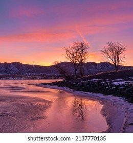 Winter Sunset - Colorful Winter sunset at a frozen mountain lake. Bear Creek Lake, Denver-Lakewood-Morrison, Colorado, USA.