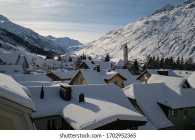 Winter Sunset Over Andermatt Village And Its Church