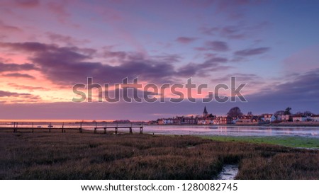Winter sunset over Bosham harbour and village, West Sussex, UK
