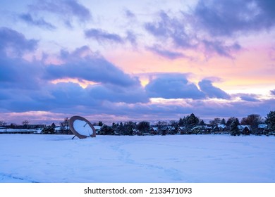 Winter Sunset Scene At Cranmer Park In The Hilltop Neighborhood In Denver, Colorado With Its Iconic Sundial And View Of The Mountain Range In The Distance.