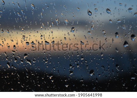 Winter sunset throught the rain 