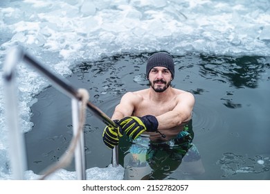 Winter Swimming. Man In An Ice-hole.