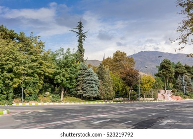 Winter Tehran Street View In Tehran International Exhibition Center With Snow Covered Alborz Mountains Against Cloudy Sky On Background