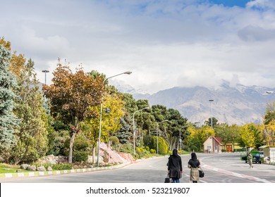 Winter Tehran Street View In Tehran International Exhibition Center With Snow Covered Alborz Mountains Against Cloudy Sky On Background