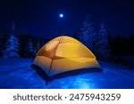 Winter Tent Camping in Colorado Wilderness. Cold Snowy High Country Night in Small Orange Tent.