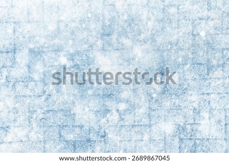 Winter texture of paving slabs covered with snow, top view, background surface in snow