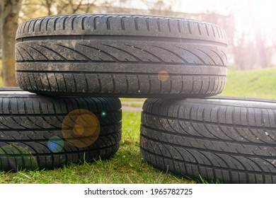 Winter Tires Close Up With Flare Effect. Self Replacement Of Winter Tires On A Car With Summer Wheels. Swap Winter Wheel For Summer Tire.