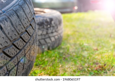 Winter Tires Close Up With Flare Effect. Self Replacement Of Winter Tires On A Car With Summer Wheels. Swap Winter Wheel For Summer Tire.