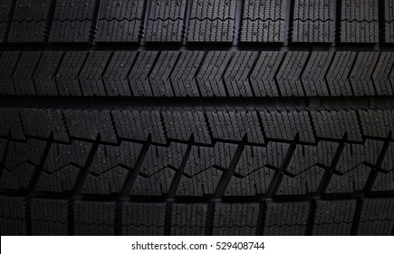 Winter tires close-up . Tyre background