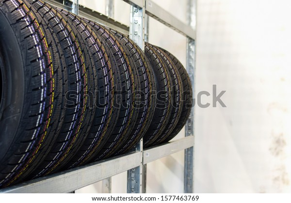 Winter tires are on the rack. Storage of winter\
tires in stock.