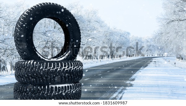 Winter\
tires on a snowy road. Seasonal tire\
change.	