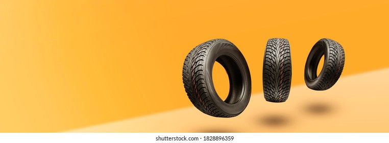 winter tires - panoramic concept with copyspace for the site header on a bright orange background. sale of tires or spare parts for the car. - Shutterstock ID 1828896359