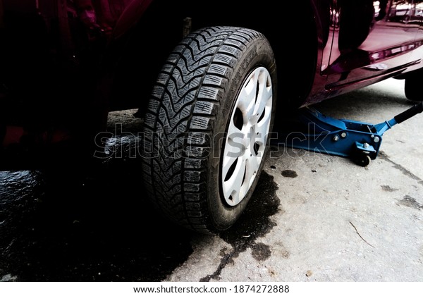 Winter Tires Are Very Safe. Changing Tires With Winter\
Tires In A Garage. 
