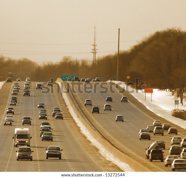 Winter Traffic on the\
highway at sunset