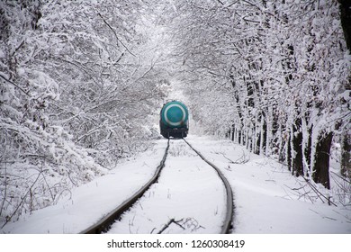 Winter train in forest.