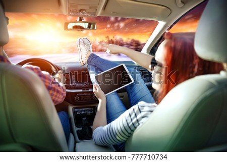 Similar – young women enjoying vacation in the car on road trip