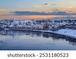 Winter in Trondheim, view of the river Nidelva and  the district Bakklandet reflected in the water