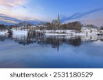 Winter in Trondheim, view of the river Nidelva and the cathedral Nidarosdomen reflected in the water 