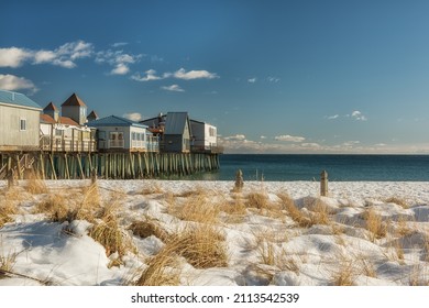 Winter View Of The Ocean Coast With An Old Pier And Colorful Wooden Houses On The Pier. USA. Maine. Portland.