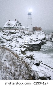 Winter view of the Portland Head Light in Maine during snow storm.
