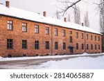 Winter view through barbed wire at Auschwitz