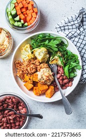 Winter Warm Vegan Buddha Bowl With Beans, Baked Vegetables, Tofu, Hummus And Beans.