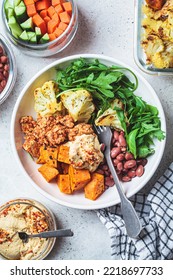 Winter Warm Vegan Buddha Bowl With Beans, Baked Vegetables, Tofu, Hummus And Beans.