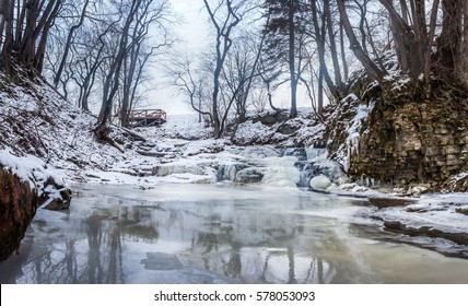 Winter Waterfall And Frozen River