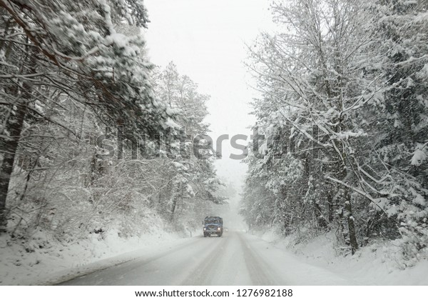 Winter weather, snow on the
road, calamity on the road. Snowstorm on  mountain pass in
Slovakia.