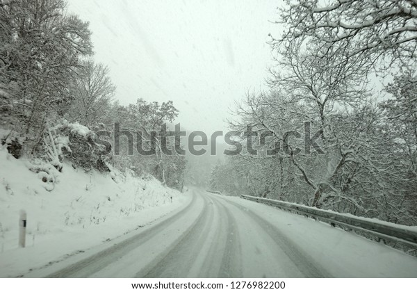 Winter weather, snow on the\
road, calamity on the road. Snowstorm on  mountain pass in\
Slovakia.