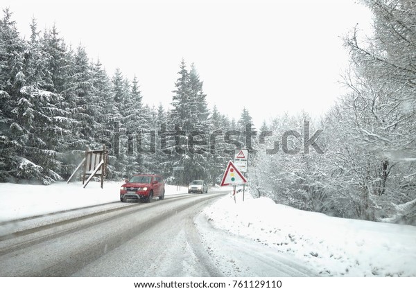 Winter weather, snow on the\
road. Snow calamity on the road. Snowstorm in Slovakia, mountain\
pass .