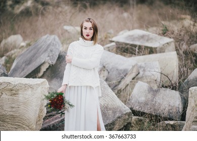 Winter Wedding. Beautiful Young Bride Posing Near Lake