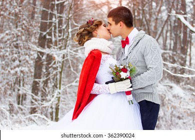 Winter Wedding. Beautiful Young Couple In The Woods.